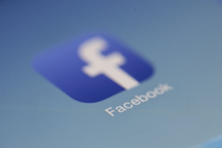 What Does Take A Break Mean On Facebook ? 1 Facebook logo on phone screen, mobile app icon close-up