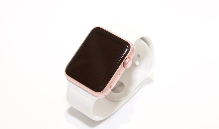 Apple Watch Black Screen - Troubleshooting Tips 1 Rose gold Apple Watch with white sport band on a white background