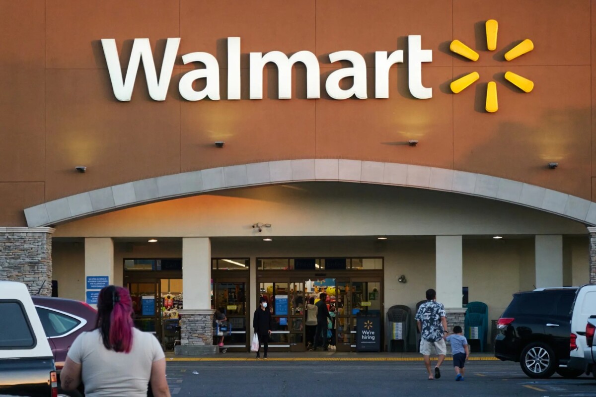 What You Need to Know About Walmart Accounts 1 Walmart storefront exterior with big logo and customers entering the store