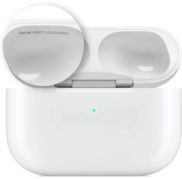 AirPods Pro serial number location engraved inside the MagSafe charging case lid, close-up view.