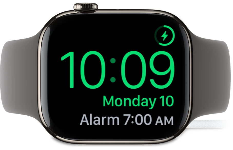 Apple Watch in Nightstand Mode showing 10:09 and a 7:00 AM alarm