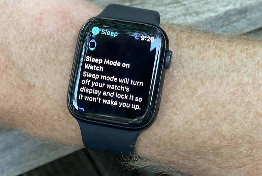 Apple Watch showing workout tracking screen with outdoor walk and indoor run options