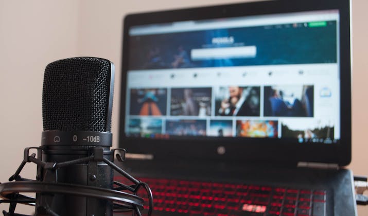 Unlock the Power of Audio Line in Your Macbook: A Comprehensive Guide 1 USB podcast microphone in front of a laptop screen